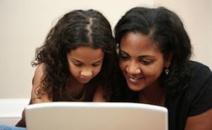 girl-on-computer-with-mom